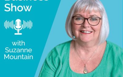 The Midlife Business Show Podcast with Suzanne Mountain Grey haired woman with glasses smiling at the camera